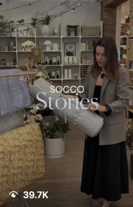 SOCCO Stories post featuring a presenter with a pillow in store